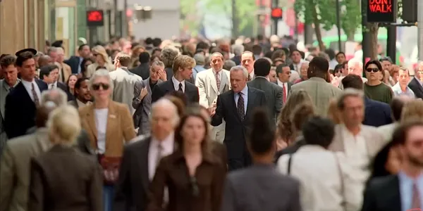 Busy city street filled with pedestrians.