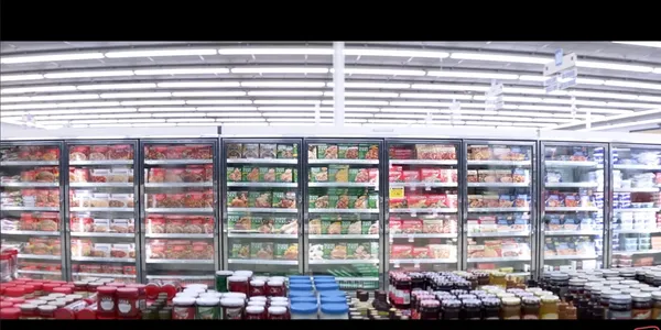 Wide view of a grocery freezer aisle.
