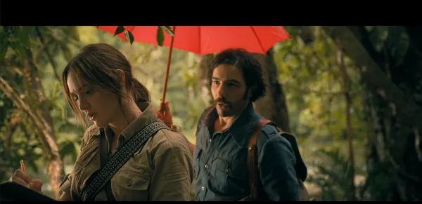 Two explorers in a jungle, one writing notes while the other holds a red umbrella