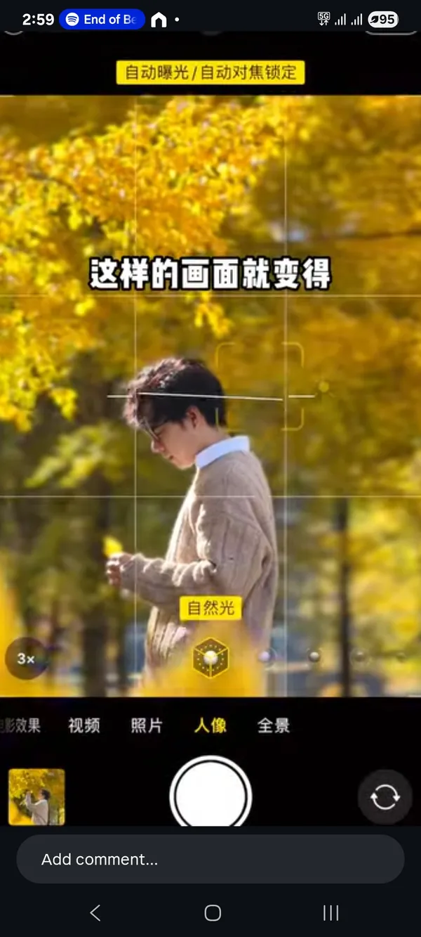 Person in a park with autumn leaves in the background.