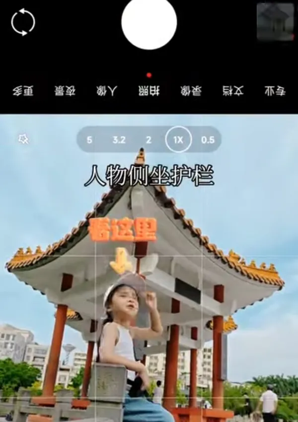 A person sitting in front of a traditional pavilion with a playful gesture.