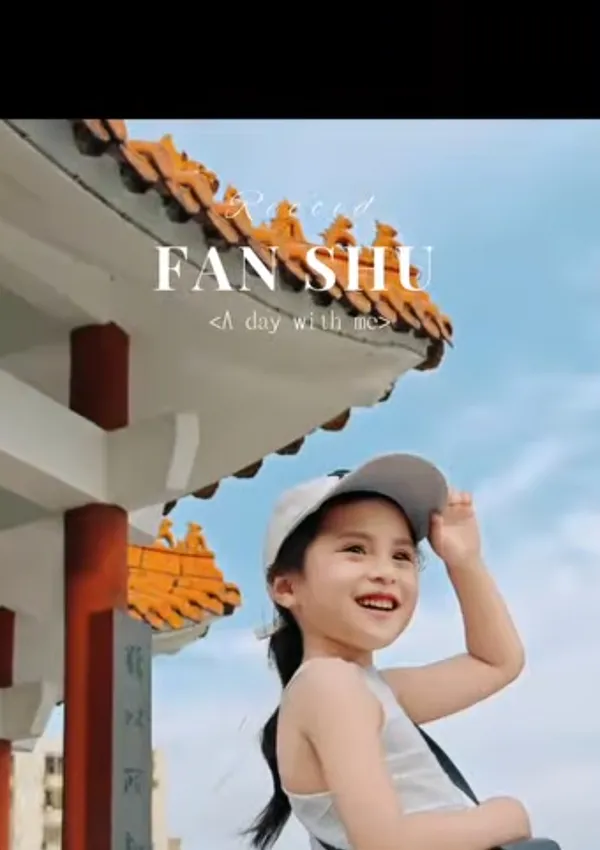 A smiling child wearing a cap under a traditional roof.
