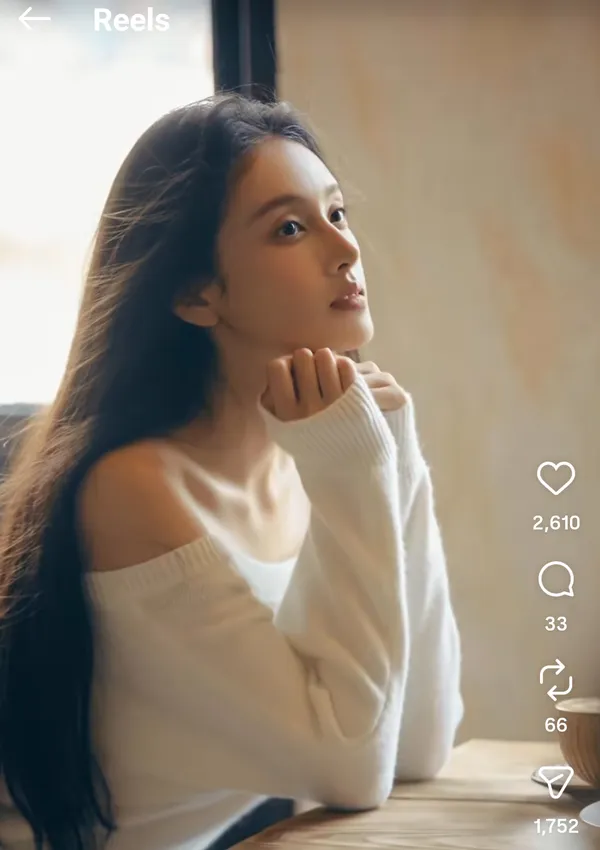 A contemplative person gazing out the window.