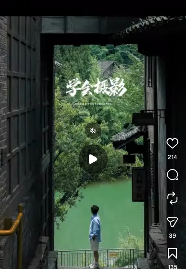 A person standing at a viewpoint overlooking a river.